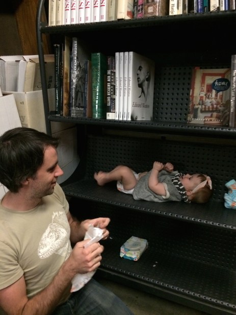 Changing a diaper at The Last Book Store. 
